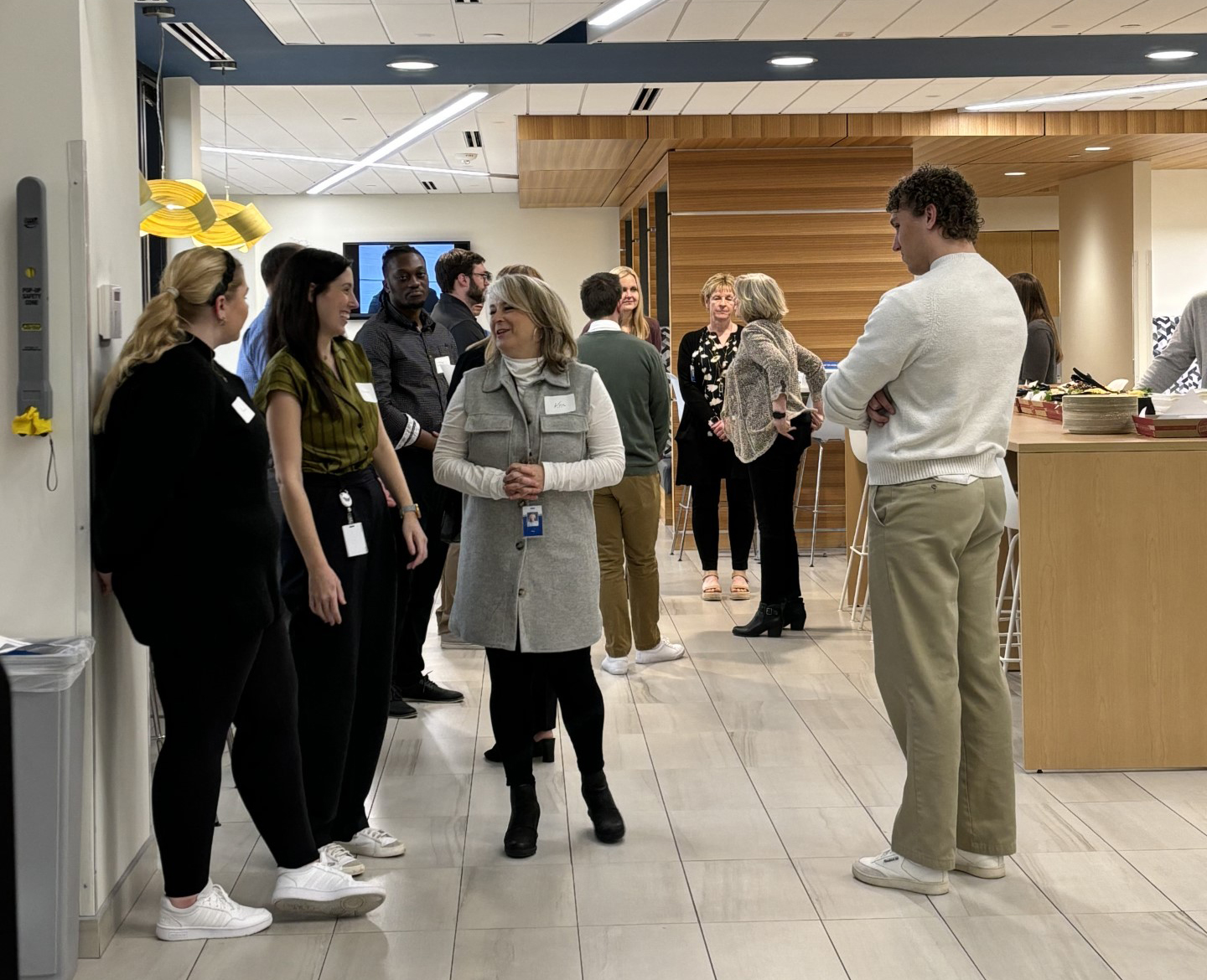 People gathered in the Edina, Minnesota lunchroom for the Trainee Program Open House.