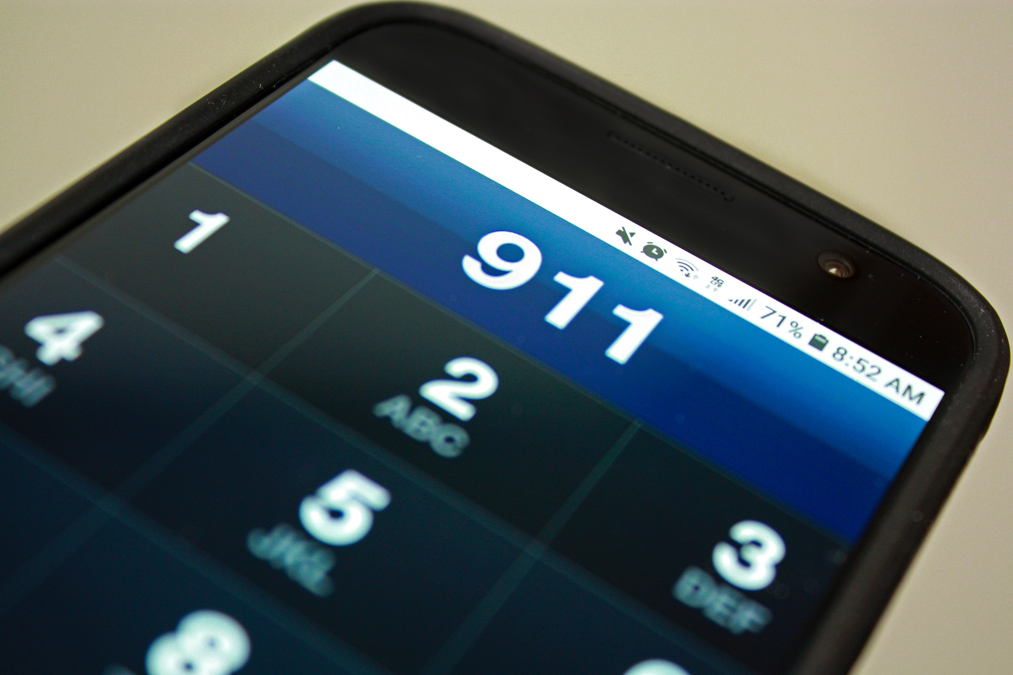 Close up of a cellphone with 9-1-1 on call screen.