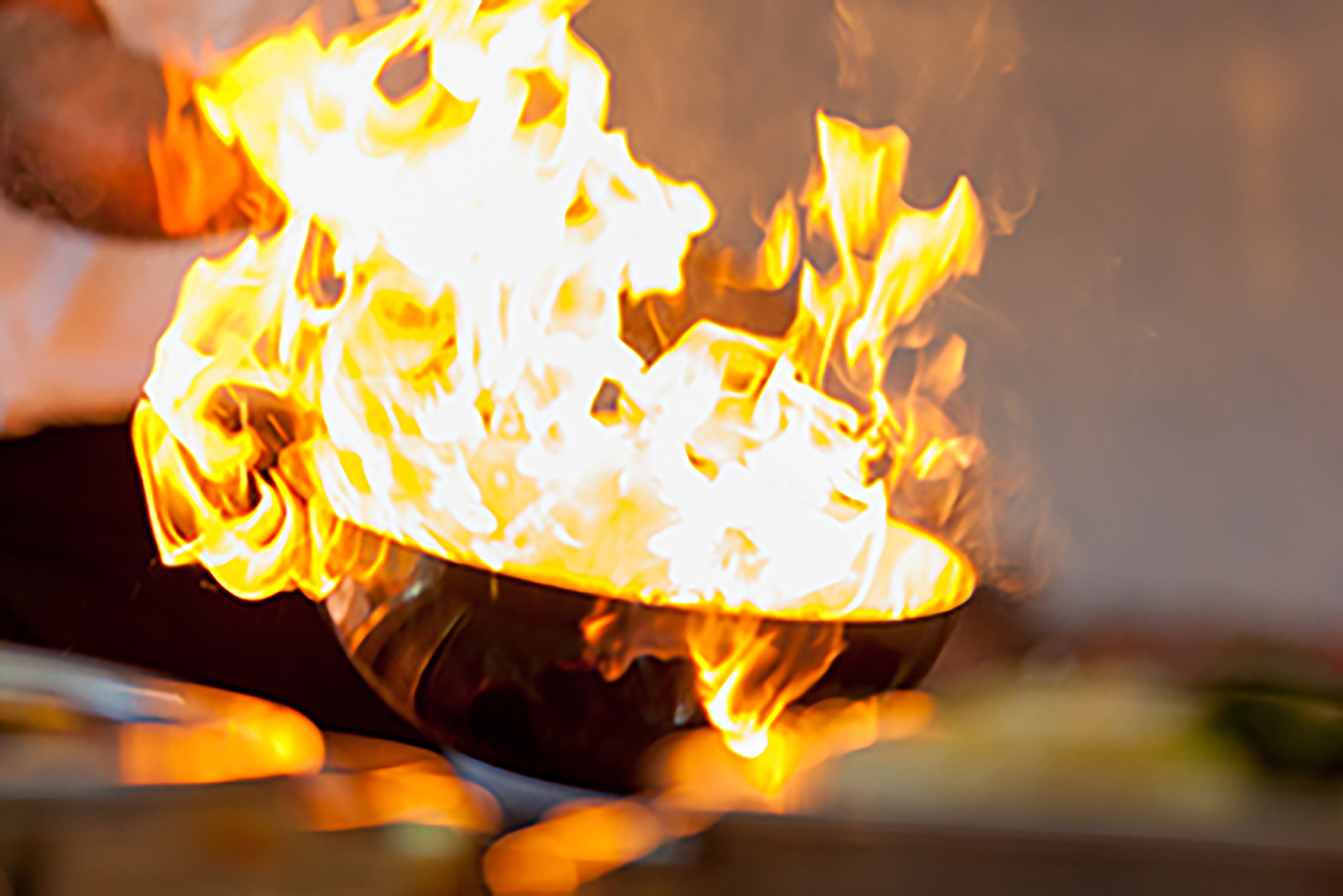 Cooking pan engulfed in flames.