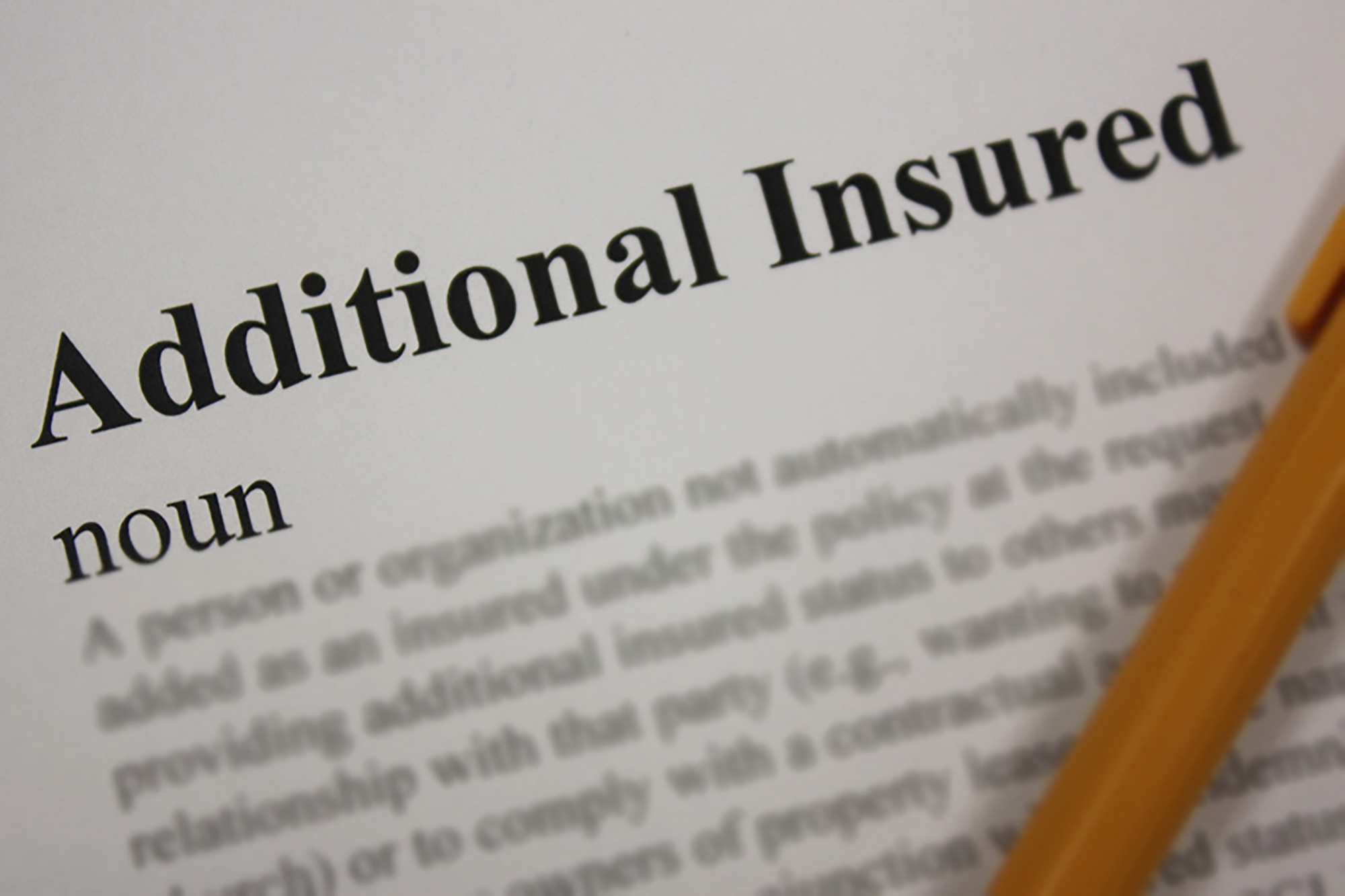 Closeup of a dictionary entry for Additional Insured.