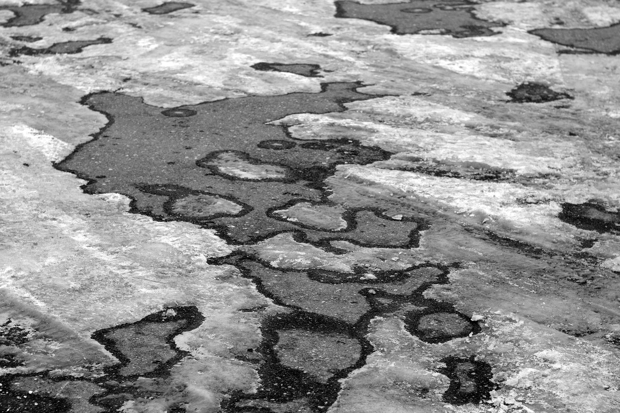 Ice covered blacktop.